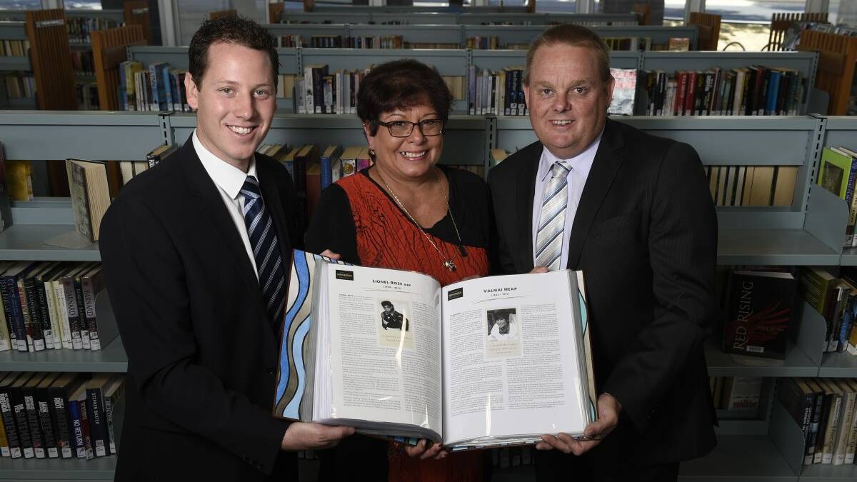 ON SHOW: Ballarat mayor Joshua Morris peruses the Victorian Indigenous Honour Role with Valmai Heap’s daughter Karen Heap and Minister for Local 
Government and Aboriginal Affairs Tim Bull at the Ballarat Library. PICTURE: JUSTIN WHITELOCK