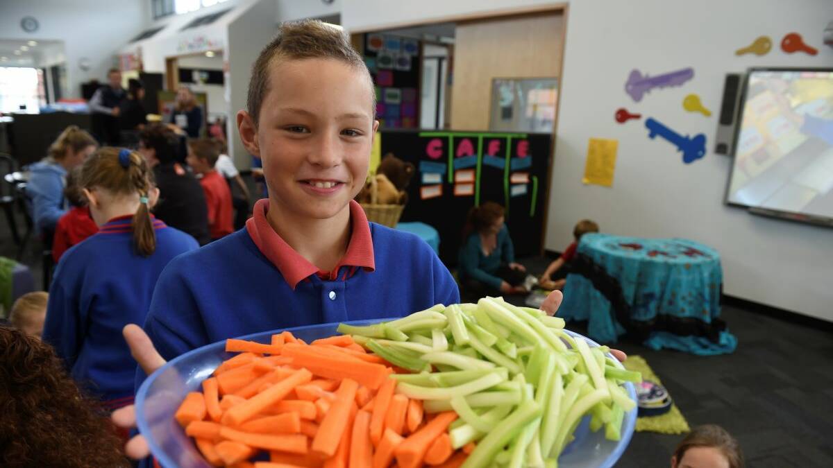 Grade 4 student Jake with fresh food. Pic: Lachlan Bence