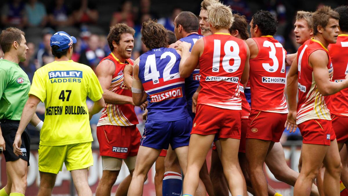 Brown at the centre of a scuffle with Western Bulldogs players during his time at the Gold Coast.