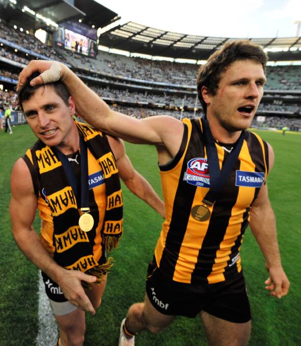 Campbell Brown celebrates with Hawthorn teammate Shane Crawford after upsetting the all-conquering Geelong Cats in the 2008 grand final.