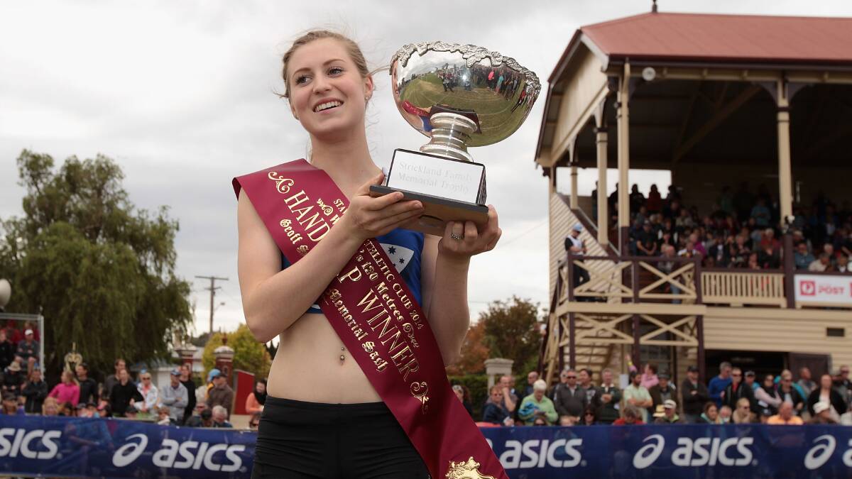 Holly Dobbyn celebrates after winning the Women's Gift 120 Metres Final during the 2014 Stawell Gift meet. PICTURE: Robert Prezioso/Getty Images