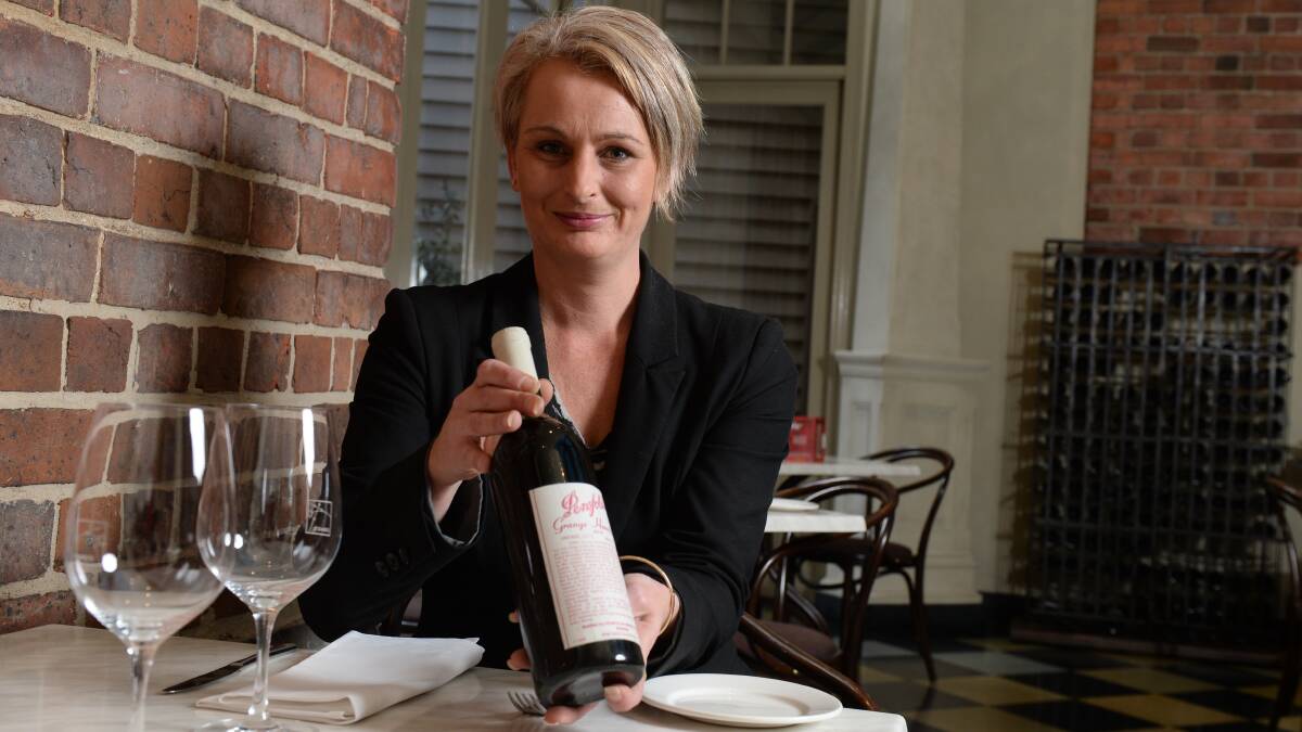 Craig's Royal Hotel office manager Beth Currie with a Penfolds Grange Hermitage, 1976 vintage. 