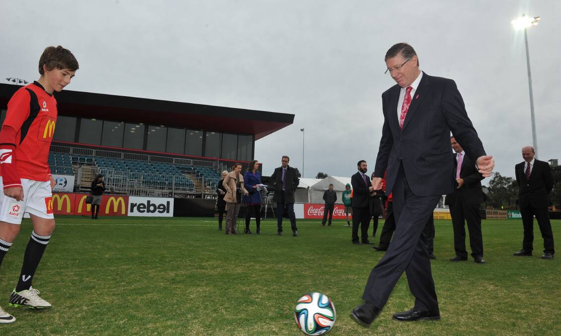 Premier Denis Napthine has a kick after announcing Ballarat will host Bahrain at the Asian Cup. PICTURE: LACHLAN BENCE