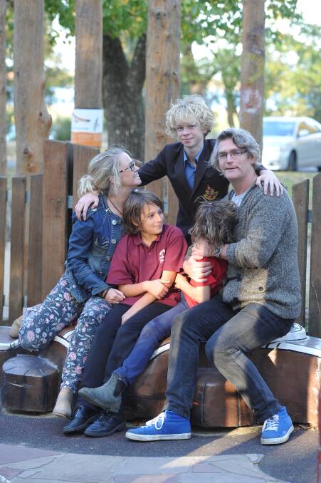 Jeff Ashmore and Susie Meadows with their family. PICTURE: LACHLAN BENCE