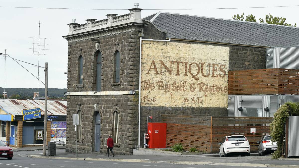 The old antiques sign on the corner of Mair and Camp streets, Ballarat. PICTURE: JUSTIN WHITELOCK