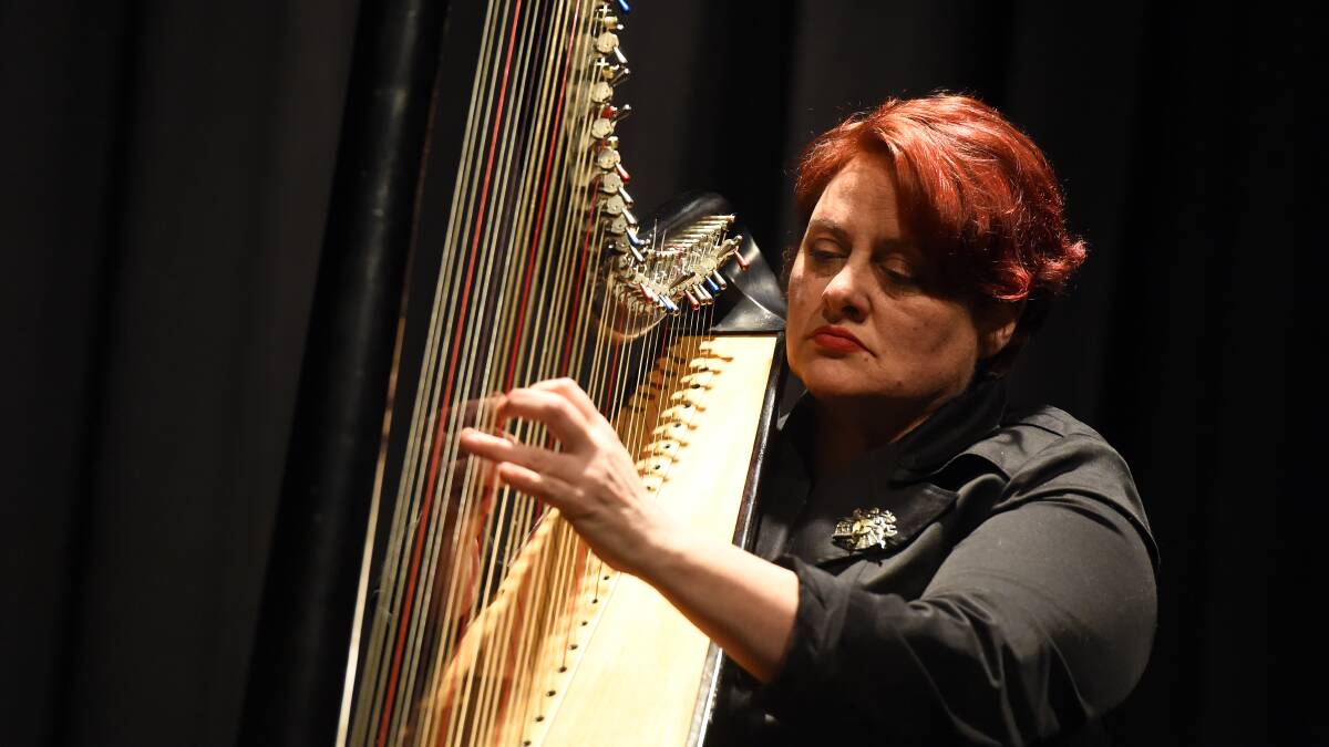 Mary Doumany plays the harp.