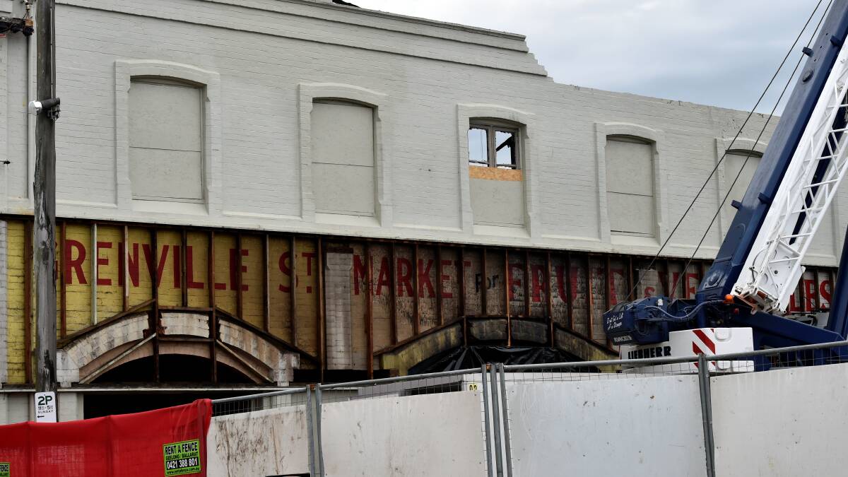 The old sign uncovered during the demolition of the Plaster Fun House in Grenville Street. PICTURE: JEREMY BANNISTER