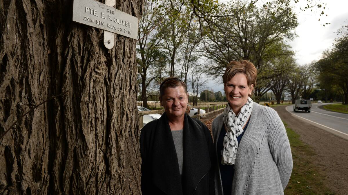 Faye Threlfall from the Bacchus Marsh Great War Centenary Group and Alison Strangio of the Avenue Preservation Group next to the tree and plaque honouring  Private Ernest Robert Oliver along the Bacchus Marsh Avenue of Honour.
PICTURE: ADAM TRAFFORD



