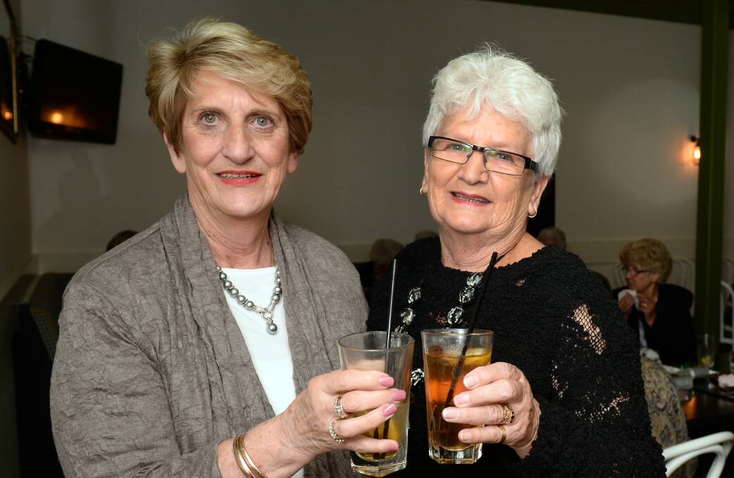 Yvonne Easton and Wendy Furlong toast the good old days of the Coles Variety Store.  PICTURE: KATE HEALY