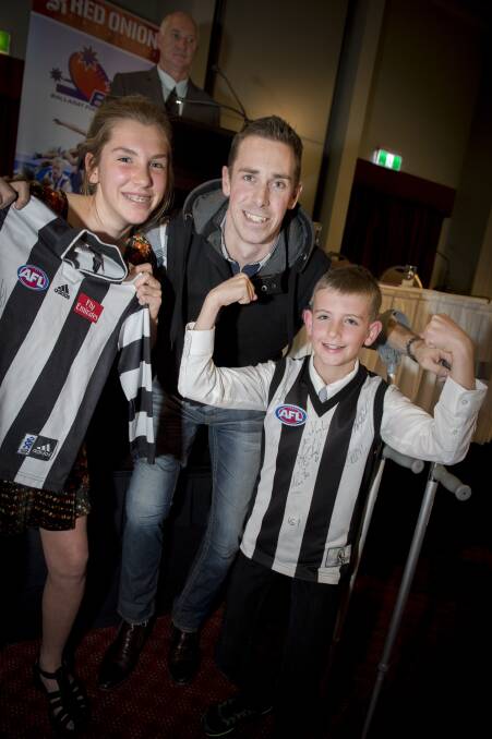 Former Collingwood captain Nick Maxwell with Maddy Selmon, 13, of North Ballarat, and Joshua Ballinger, 10, of Redan,
at the Ballarat Football and Netball League junior best and fairest awards on Wednesday night. Picture: Shawn Smits