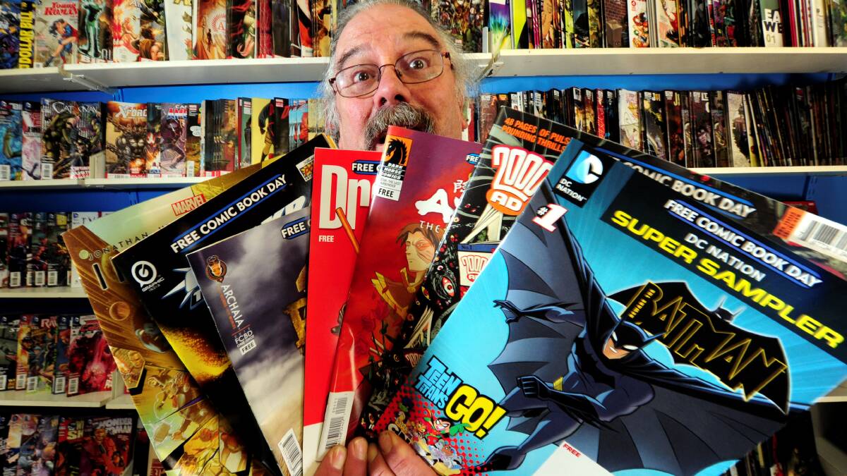Heroes HQ Ballarat. Owner Garry Fay with a selection of comic books.
PICTURE: JEREMY BANNISTER