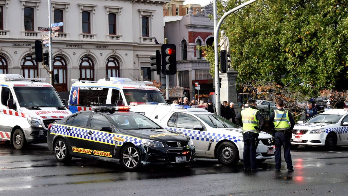 Three people were hit by a police car at the intersection of Sturt and Lydiard streets on Sunday afternoon. PICTURE: JEREMY BANNISTER