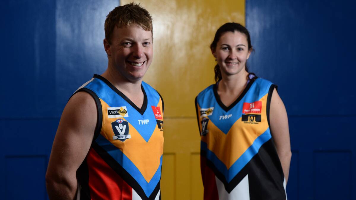 Daniel Parker and Emma Powell in the special jumpers that Sebastopol will wear on Saturday for the fundraising match. 
PICTURE: ADAM TRAFFORD