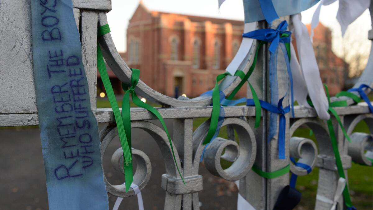 Ribbons and messages of support have been tied to the St Patrick’s College gates. PICTURE: KATE HEALY