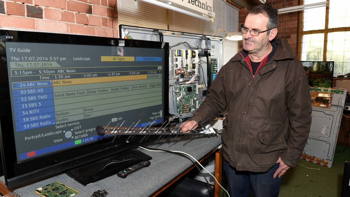 Ballarat TRS owner Peter Fontana retunes a television. PICTURE: LACHLAN BENCE