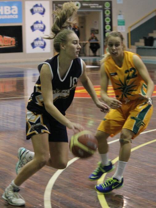  Rush’s Kasey Burton takes control of the ball during the match against Waverley in which she was a prolific scorer.