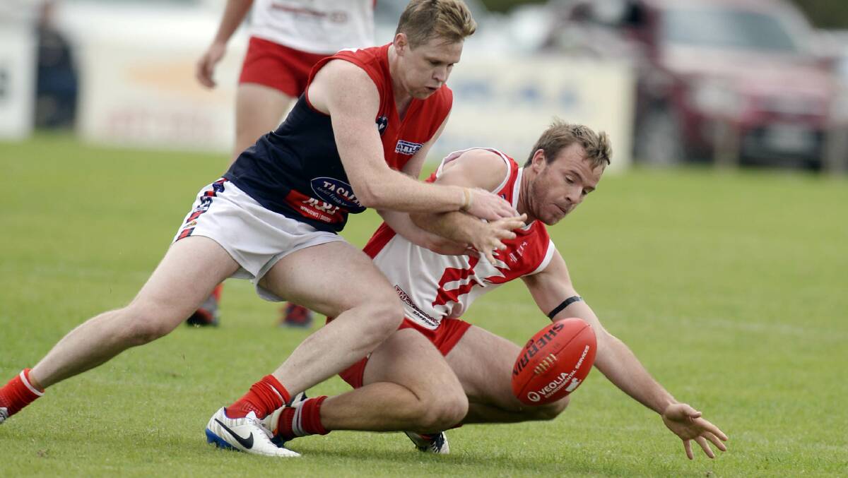Andrew Riordan, right, playing for Shepparton Swans.