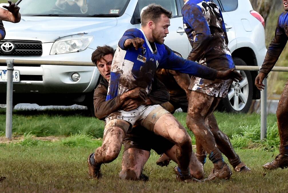 Springbank's Chris Harry tackles Waubra's Paul Dodds on Saturday. Picture - Jeremy Bannister.