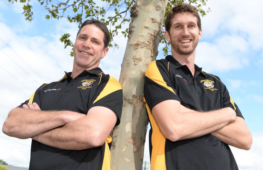 New Springbank coach Terry Simpson and recruit Michael Searl are on board with the Tigers for 2015. Picture - Kate Healy.