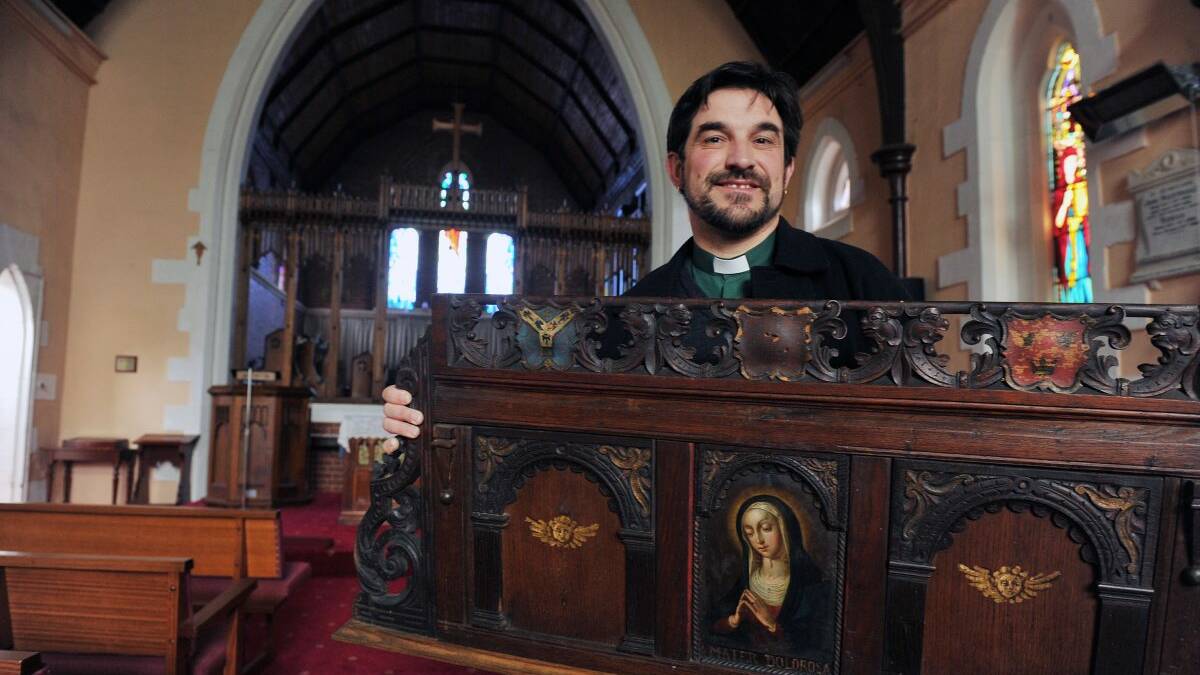 Former priest reverend Andrew Eaton pictured holding one of the stolen items - a 100 year old Marth Delorosa alter piece donated to the church in 1935.