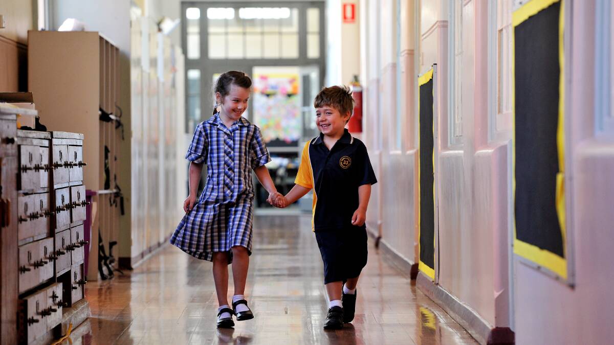 Dana Street Primary School preps Lilac Remilton and Oscar Lamont on their first official day at school on Thursday. PICTURE: JEREMY BANNISTER