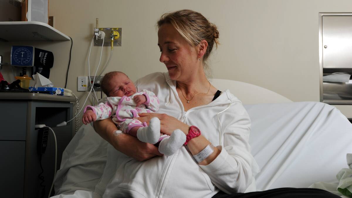 Kristy Rumler-Trainor with her newly born baby girl.