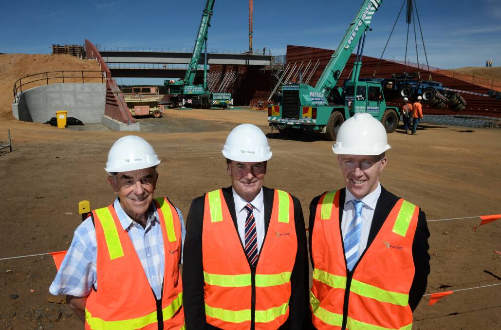 President of the Arch of Victory/Avenue of Honour Committee Bruce Price, Western Victoria MP Simon Ramsay and Western Highway duplication project director (Vicroads) Michael McCarthy at the construction site. 
