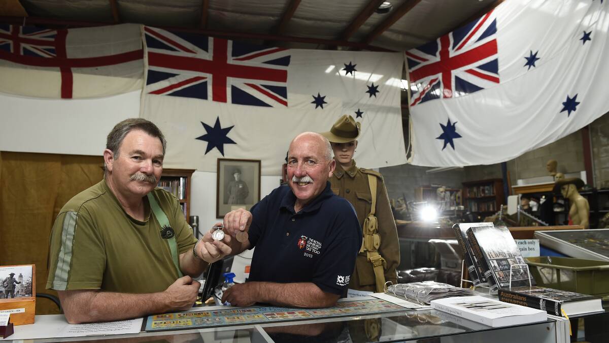 Militaria buff David Wright and Creswick RSL secretary Phil Carter with the medals. PICTURE: JUSTIN WHITELOCK