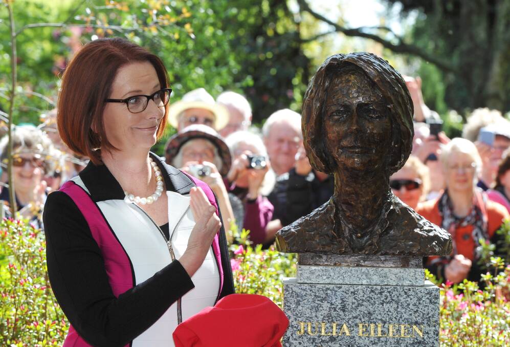 Former prime minister Julia Gillard admires her statue, the latest to be unveiled in the Botanical Gardens avenue. PICTURE: LACHLAN BENCE