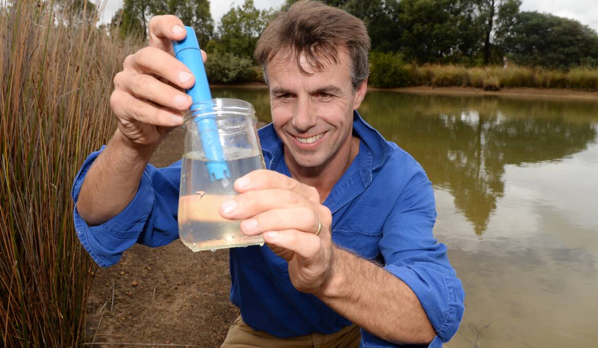 Ballarat Grammar School agriculture teacher Matt Dickinson with a water sample.