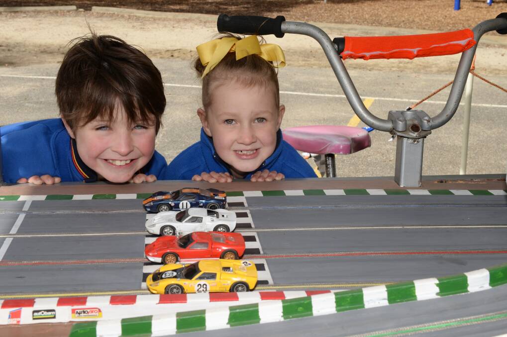 Pupils of Pleasant Street Primary School test out the pedal powered slot cars ahead of the YMCA school holidays program. PICTURE: KATE HEALY.