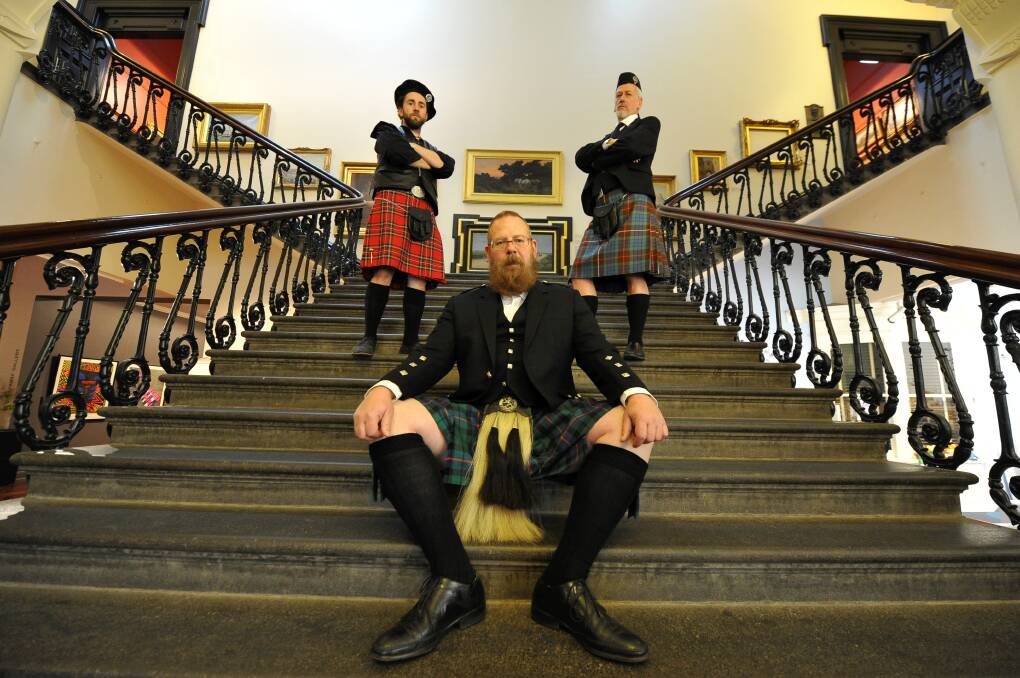 For Auld Lang Syne: Ben Cox, Gordon Morrison and Peter Freund proudly show off their tartan as part of the Art Gallery of Ballarat’s launch of the Scottish exhibition. PICTURE: LACHLAN BENCE