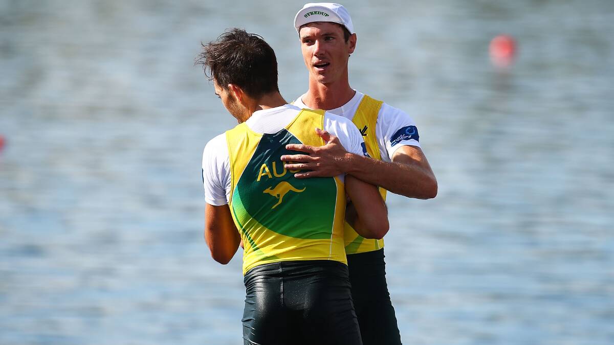 Perry Ward and Adam Kachyckyj of Australia celebrate coming third in the Lightweight Mens Double Sculls race during the Rowing World Cup. Photo: Getty
