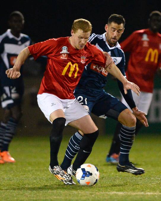 Shaun Romein (Ballarat), pictured against superstar Carl Valeri (Melbourne Victory) in last week’s friendly, scored a miracle goal on Saturday to keep the Red Devils in the race to avoid relegation.