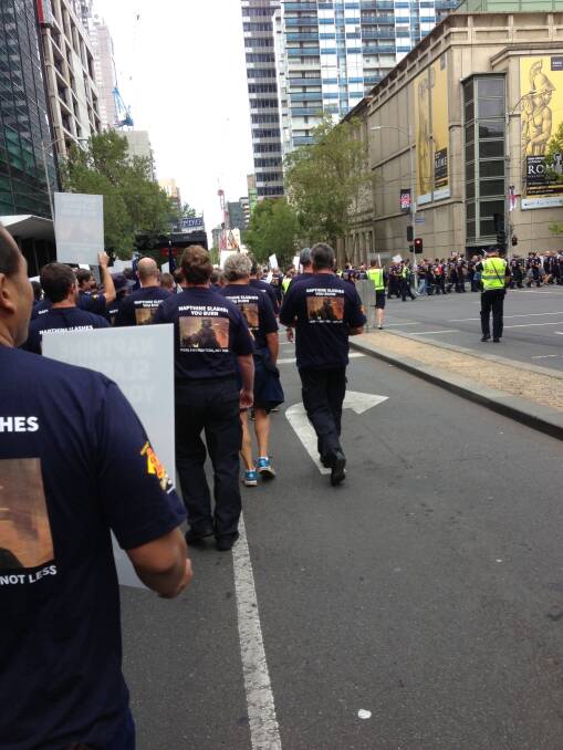 Protest: Firefighters take to the streets.