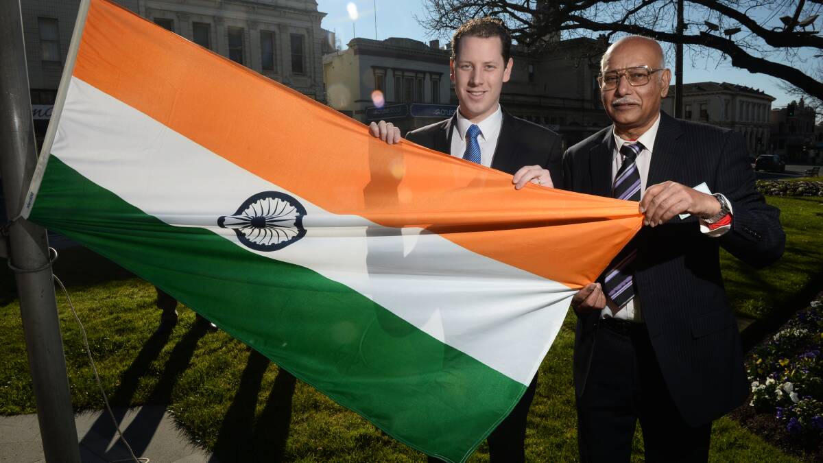 Ballarat Indian Association president Khushi Maharaj and Ballarat mayor Josh Morris raise the Indian flag on Friday to mark Indian Independence Day. 