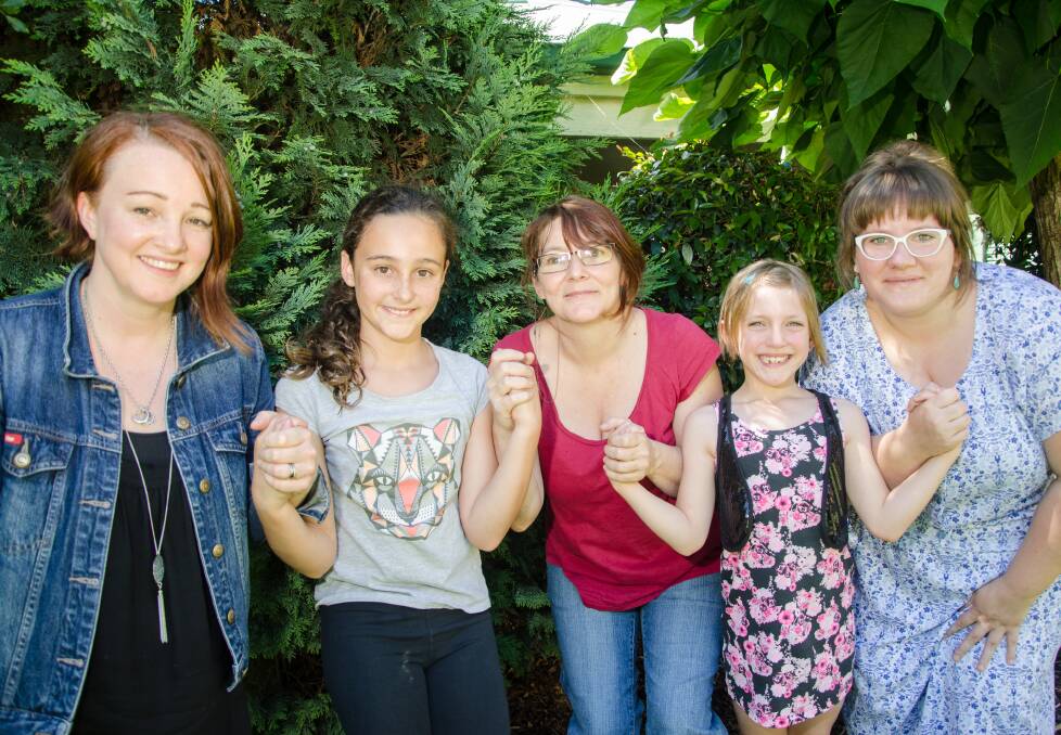 Unbroken: Reclim the night organisers and their daughters, Cathrine Farrah, Isabelle, 10, Kate Poynter, Niamh, 7, and Siobhan Fearon will stand togther against gender-based discrimination. 