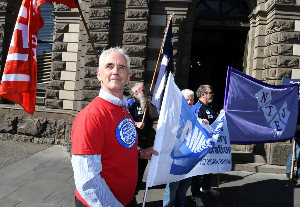 WORKERS RIGHTS: Ballarat ANMF organiser Alan Townsend protesting with members of the Ballarat Trades and Labour Council at Town Hall. Picture: Lachlan Bence. 