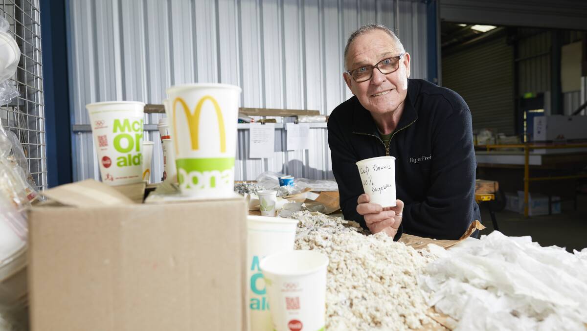 REDUCE, REUSE, RECYCLE: Dennis Collins of Paper Freight with the coffee cups and recyclables he processes to stop excess waste ending up in landfill. 