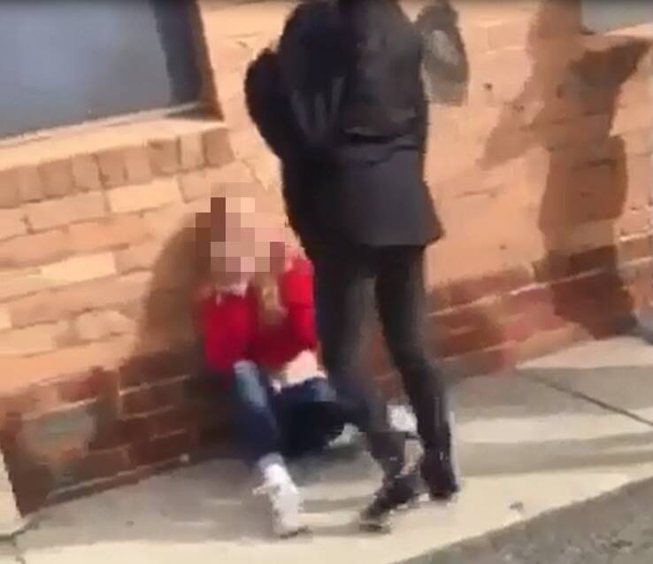 A screenshot of one of the videos. The victim in the red jumper was kicked in the head.