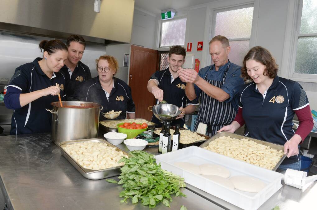 Cooking: Mars volunteers Rhiannon White, Marty Bauska, Sue Beard, Pat Fitzgibbon, Gavin Anders and Alice Bullock learning how to make gnocchi. Picture: Kate Healy