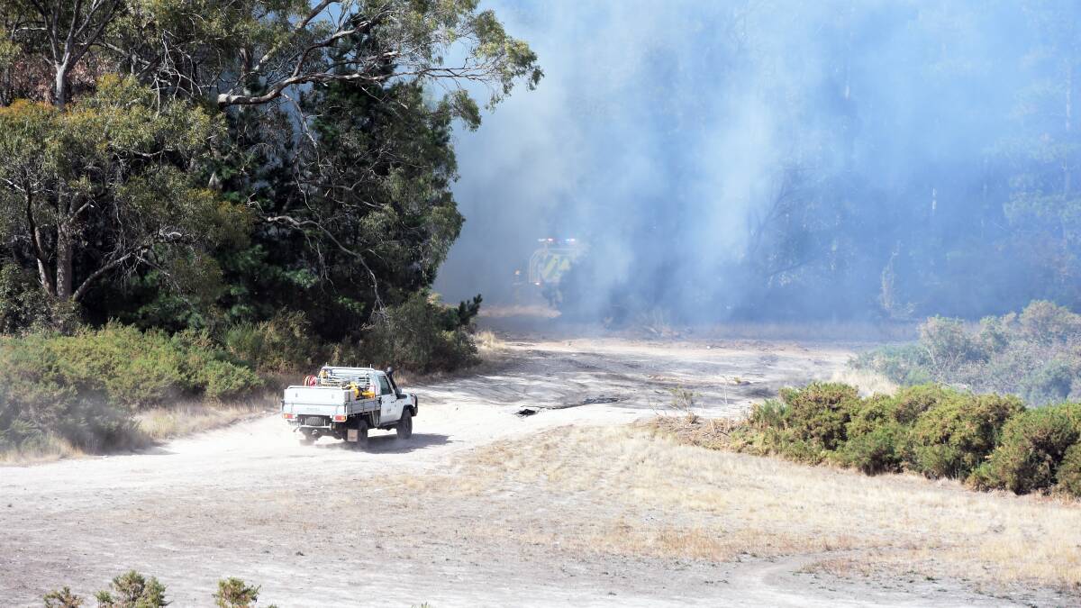 Mopping Up:  CFA units worked on a fire in a plantations south of Mt Clear on a windy afternoon.