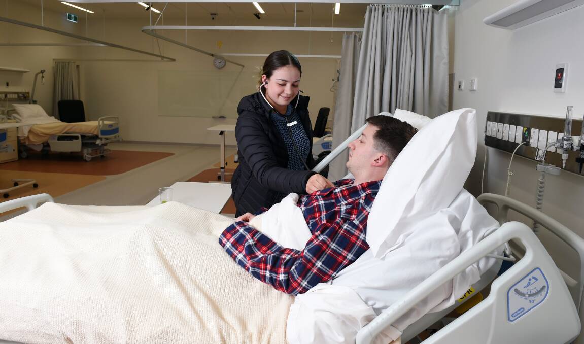 LEARNING LAB: Sophie Baker and Simon Lewis  are among second year ACU physio students using high tech simulator labs to help learn their skills. Picture: Kate Healy 