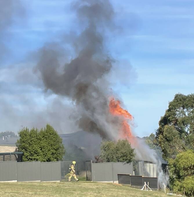 Flames leap from a shed at Nerrina that caught fire after spreading from a neighbouring shed. The fire that started in the first shed was suspected of housing a hyrdroponic set up. Picture by Alex Ford.