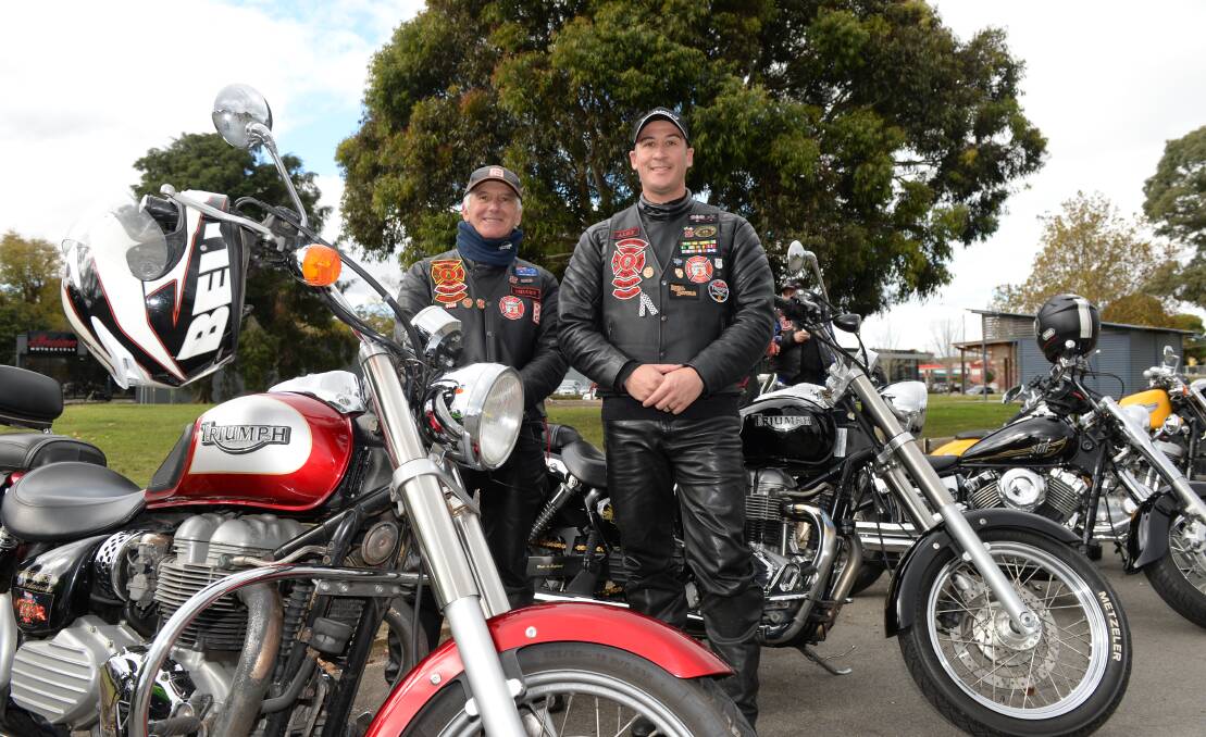 AWARENESS: Charles Vella and his son Alex were part of a large group of bikers intent on highlighting the urgency of PTSD among veterans. Picture: Kate Healy 