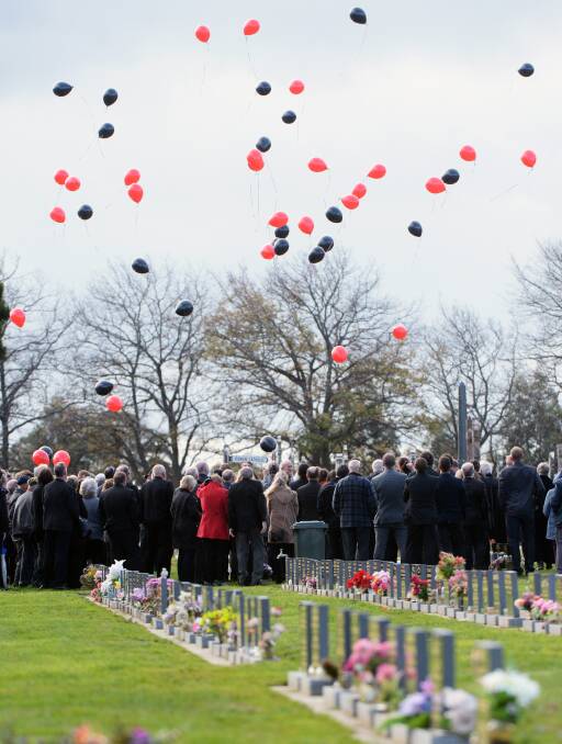 Farewell: Bill Cosgrave's passion and involvement in sport particularly his lifelong love of Essendon FC were honoured at his funeral on Wednesday. Picture: Kate Healy