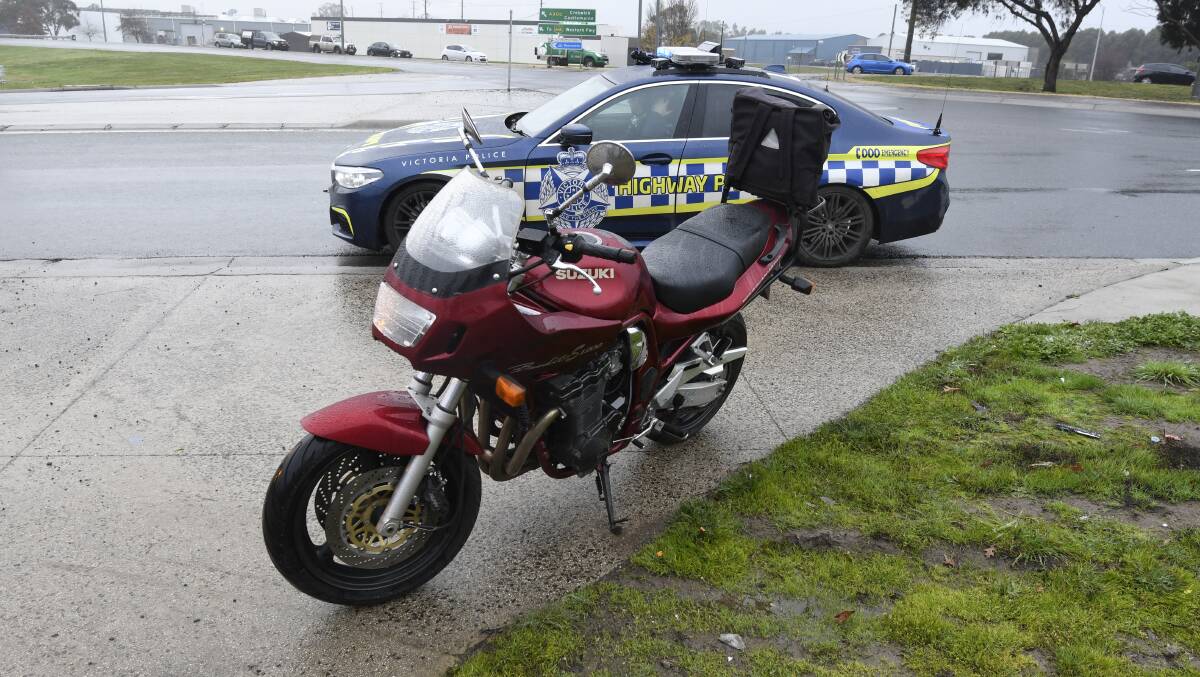 TOWED: The motorcycle was towed from the scene, after a 7.45am collision at the Creswick Rd (Midland Hwy) roundabout in North Ballarat. Picture: Lachlan Bence.