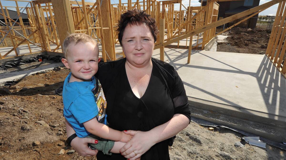 HIgh and dry: Victims Sue Emery and her three-year-old Sue Tanner  were at the first stage of building their family home when Watersun imploded.
