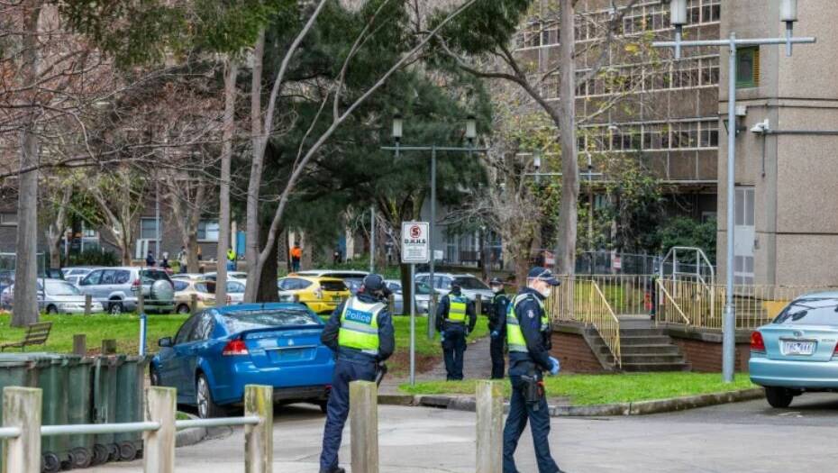 Police on patrol outside public housing towers in North Melbourne.PICTURE:ASANKA RATNAYAKE/ The Age