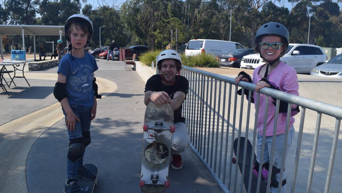 Skate instructor Richard Flude with siblings Patrick (7) and Stella (9) 